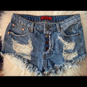 Distressed denim shorts